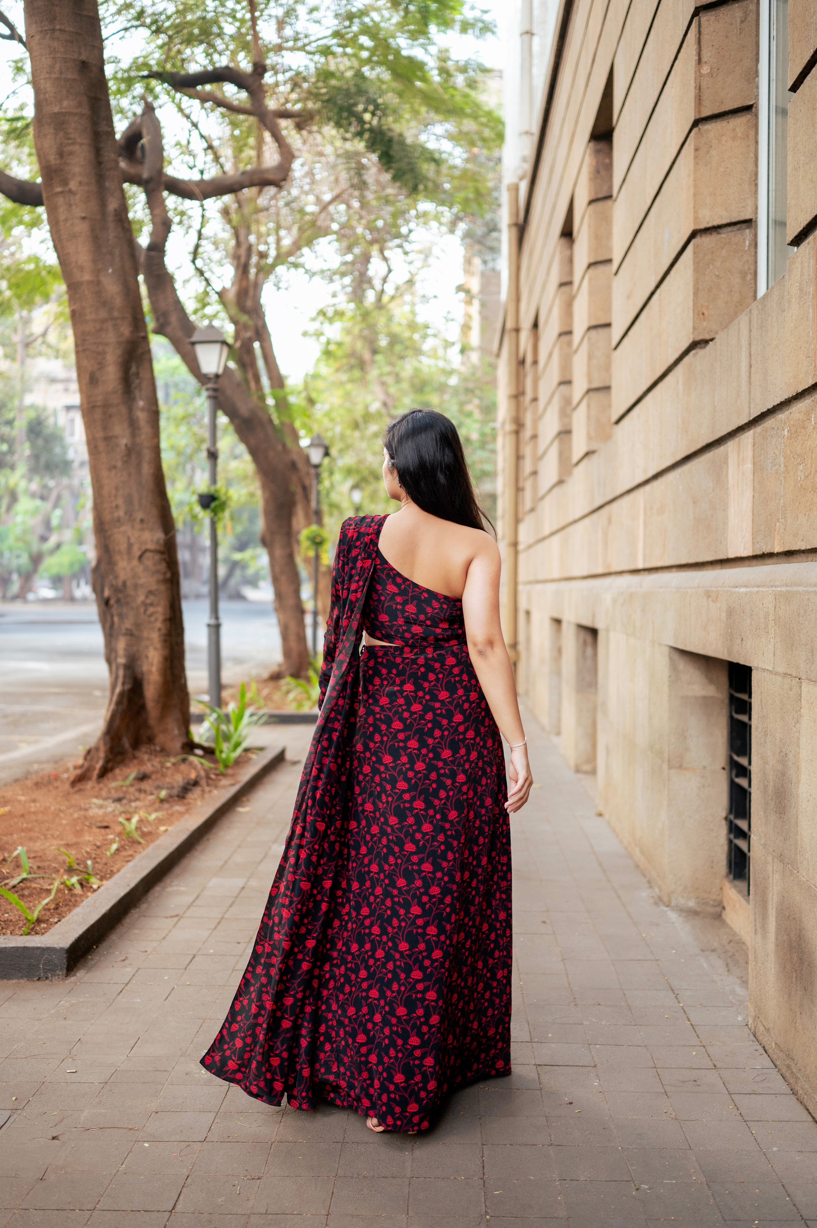 Pleated saree with one-shoulder blouse