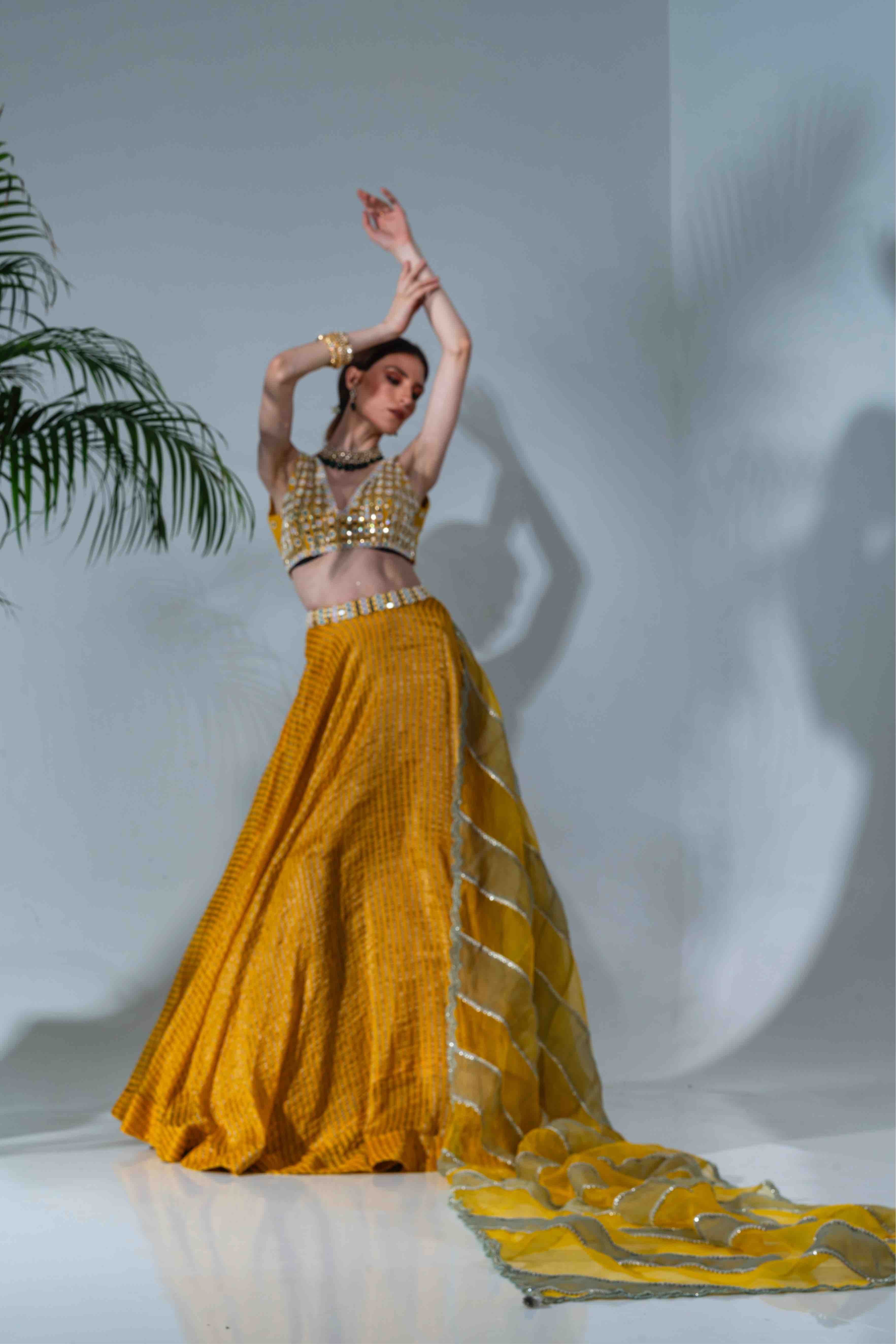 Yellow tissue silk lehenga with mirror work