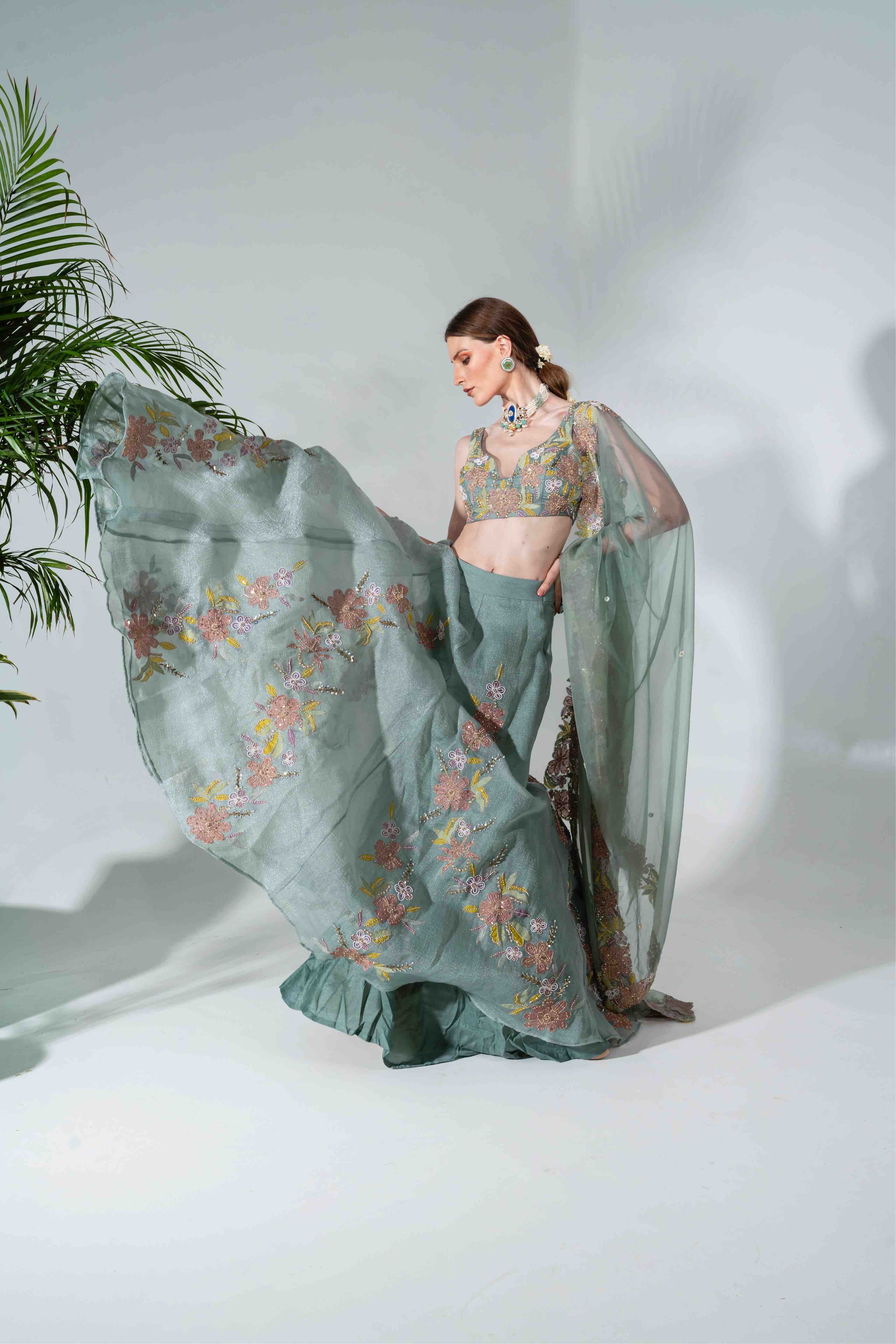 Dusty green lehenga featuring floral applique patterns